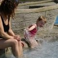 A mom and her daughter take advantage of swimming pools of Léveno